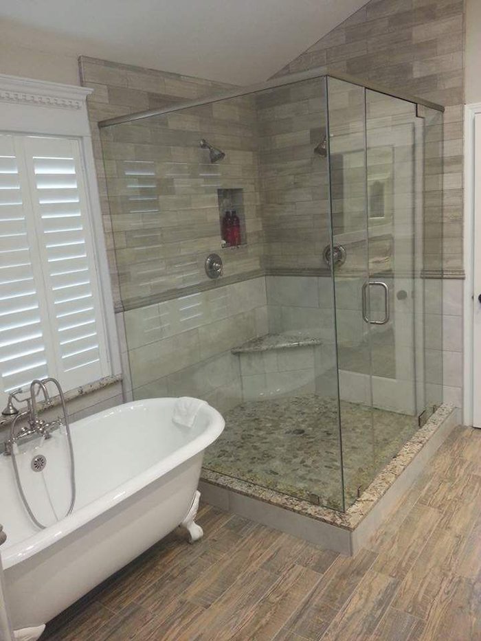 Bathroom remodel featuring a frameless glass shower and a freestanding clawfoot tub