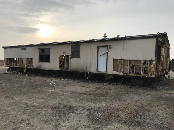 Fire damaged structure being demolished and cleared