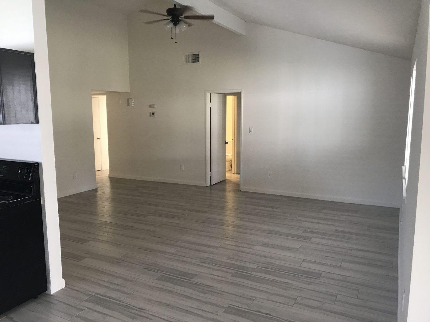 Interior renovation in progress with new drywall, paint and a vaulted ceiling