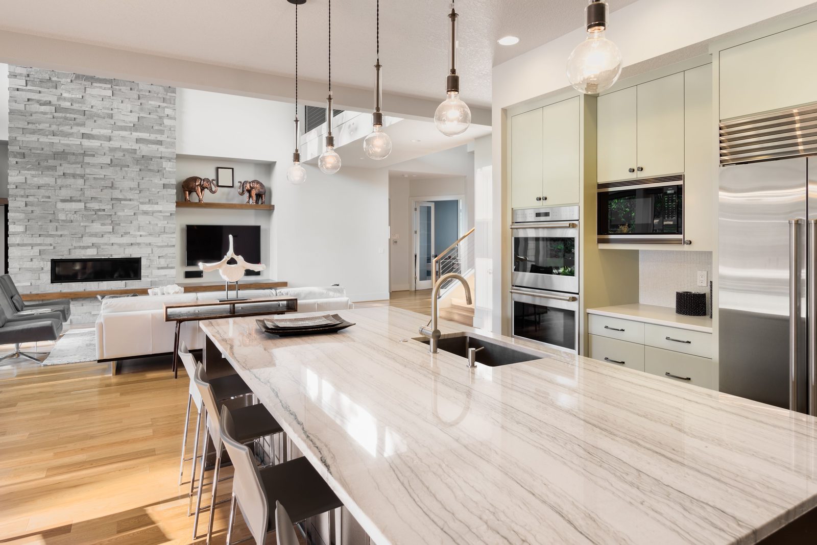 Remodelled kitchen with stone island and custom cabinetry by Patterson and Sons Construction in Bakersfield