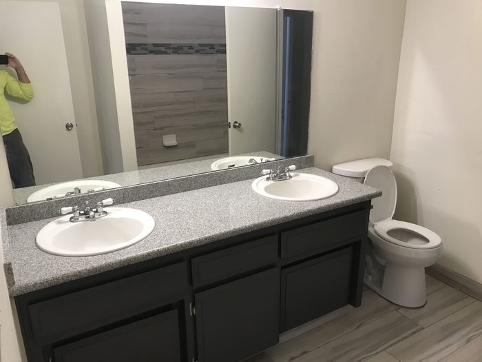 Master bathroom remodel with a dual vanity and stone countertop