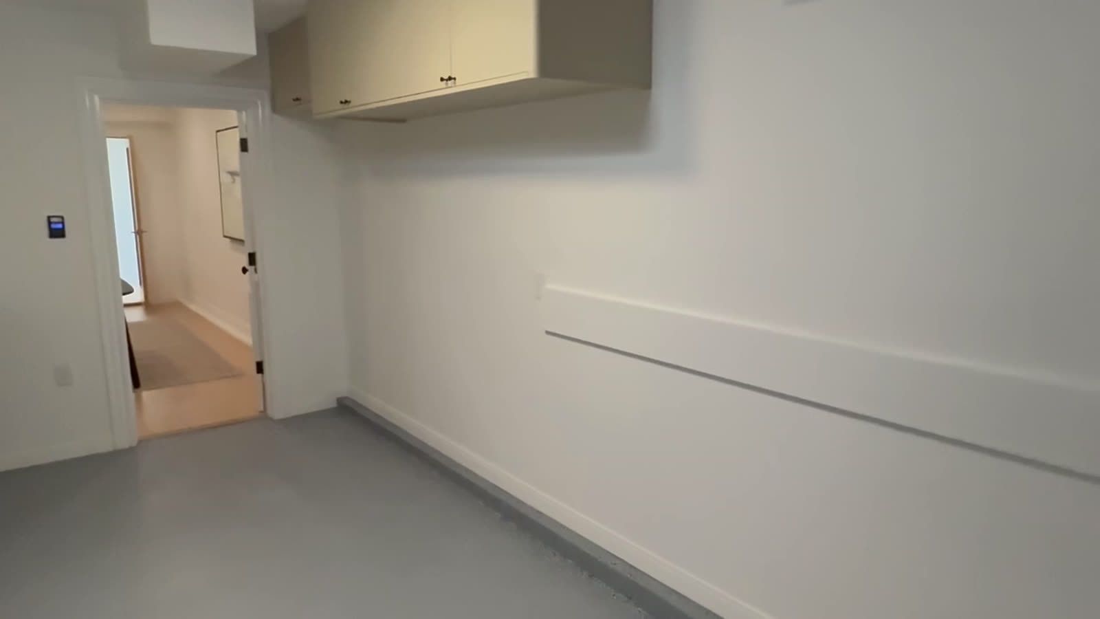 Finished corridor and casework in a completed commercial fit-out ready for handover