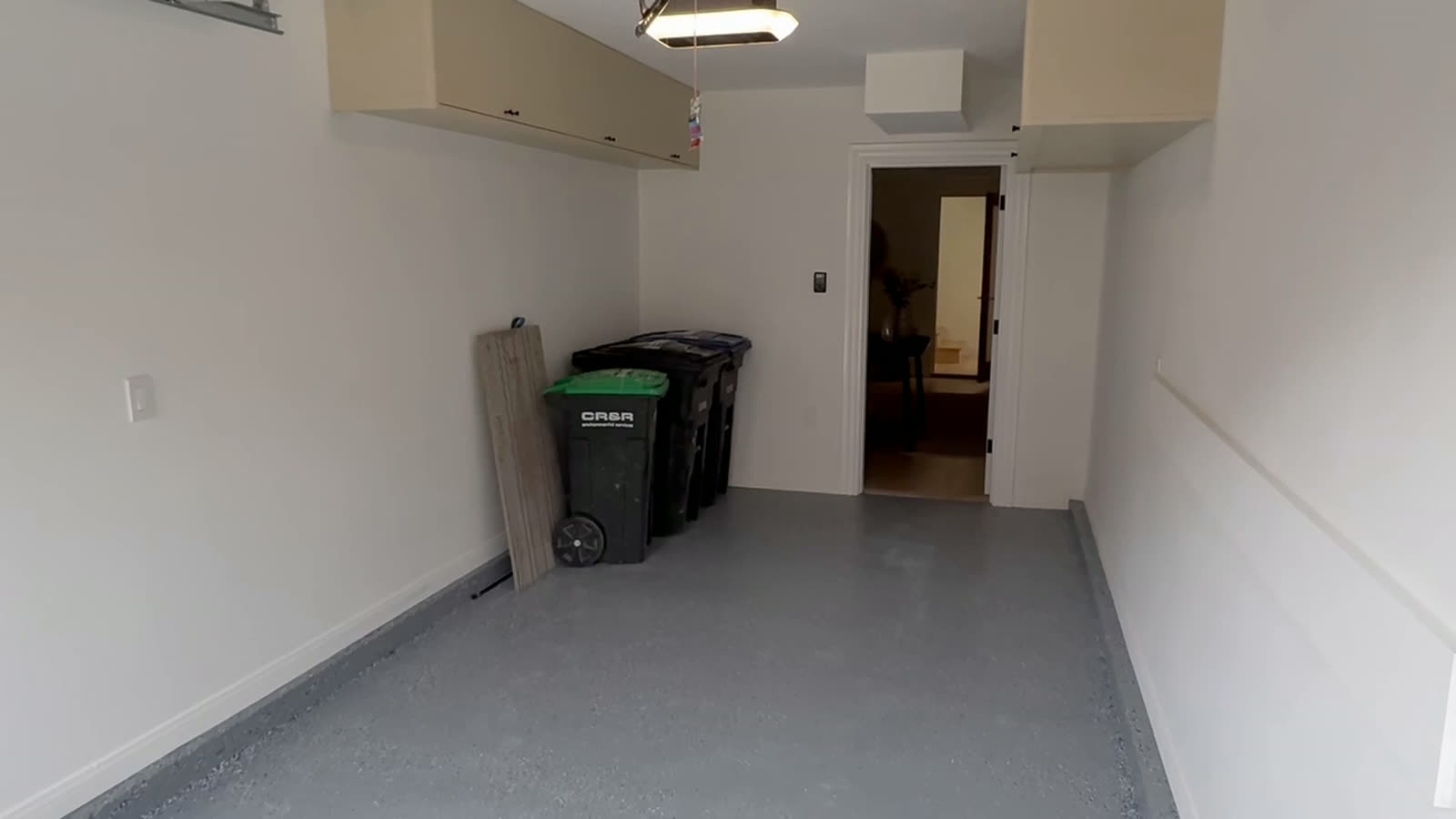 Walkthrough of a finished commercial interior with painted walls, upper casework and a sealed floor