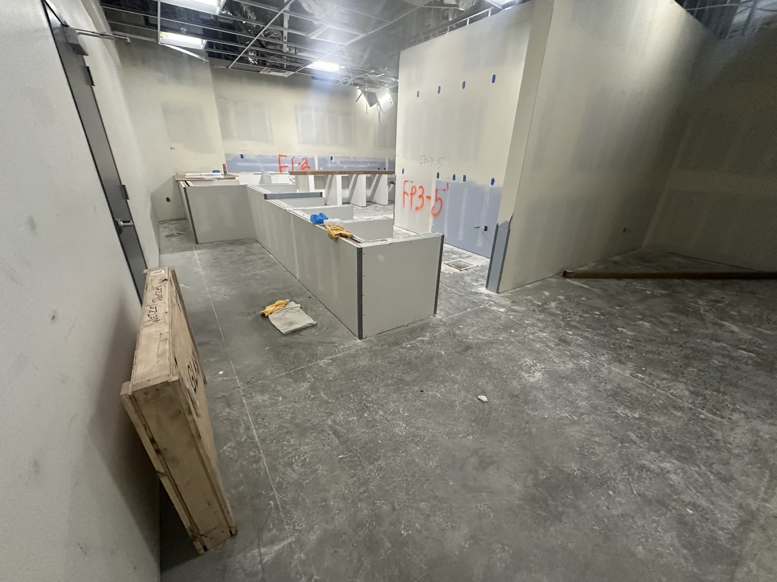 Service counter and low wall formed in drywall, corners beaded, waiting on the finish trades